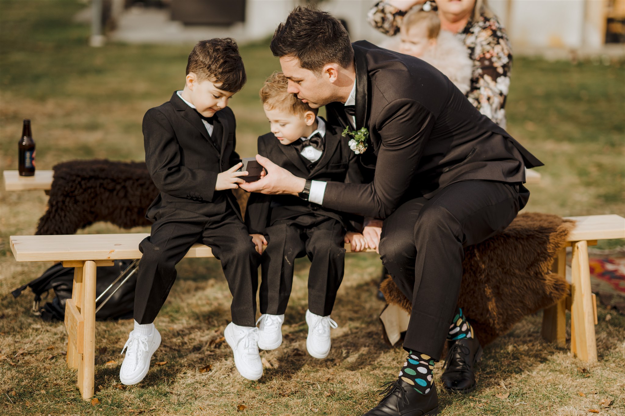 ring bearer boys and groomsmen hold wedding rings during wedding ceremony in Queenstown, New Zealand