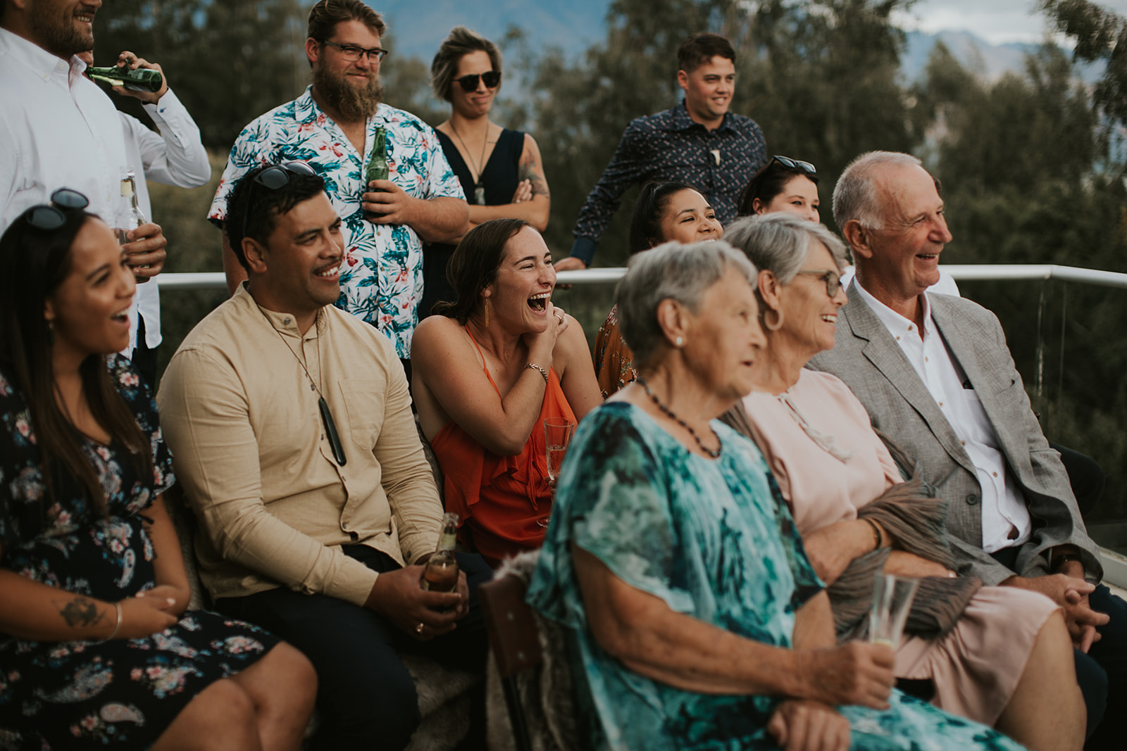 guests laugh during funny wedding ceremony reading at Queenstown wedding