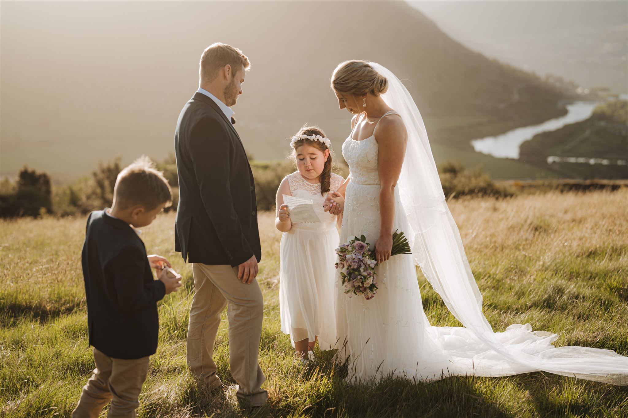 child daughter reads poem during mum and dad's wedding ceremony in Queenstown, New Zealand