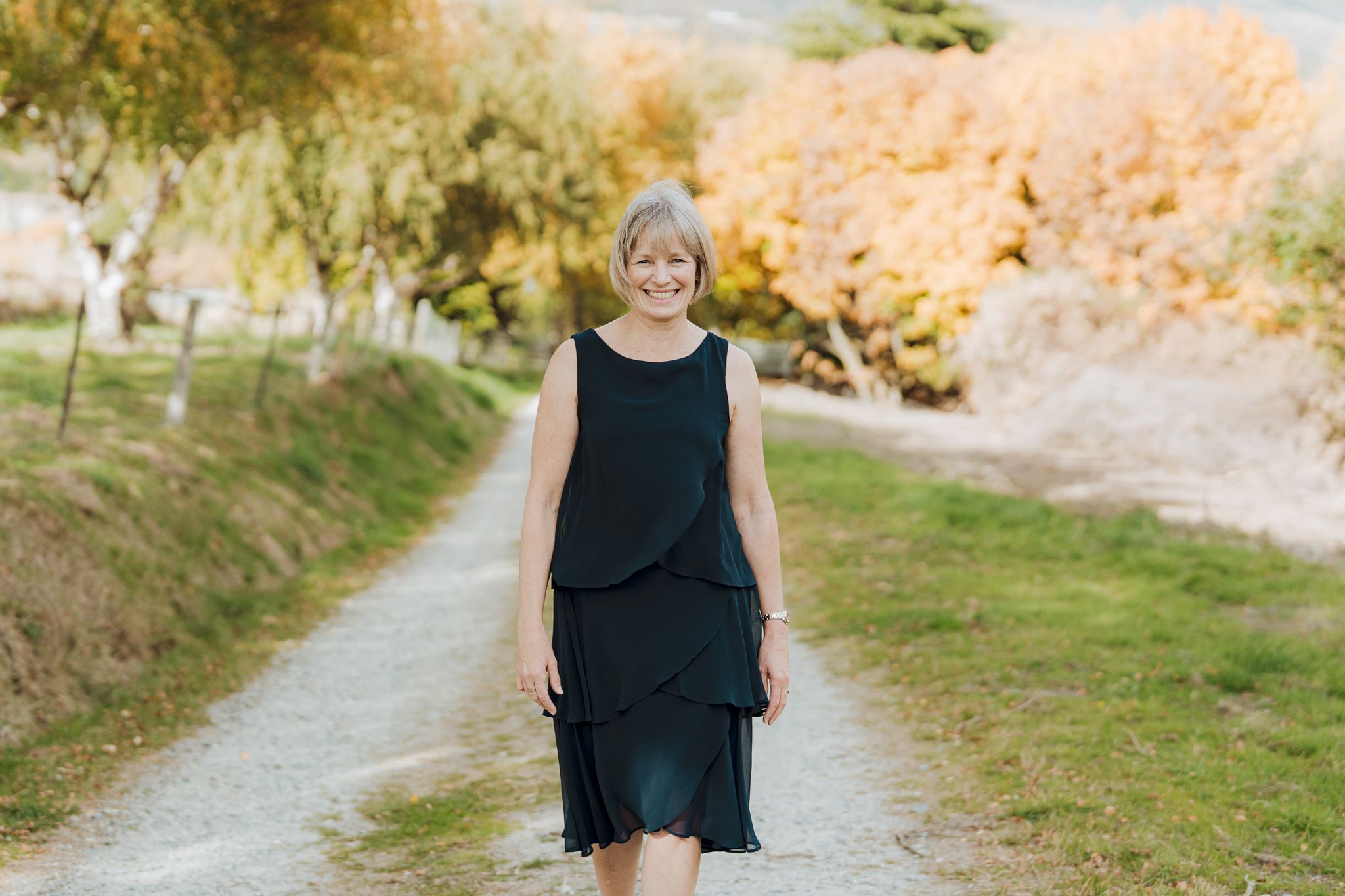 Your Big Day bride and groom stand with celebrant for elopement wedding at Royalburn Station in New Zealand